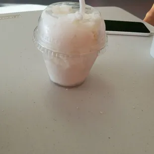 a drink in a plastic cup