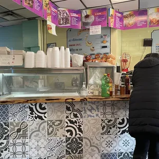 a woman standing at a counter
