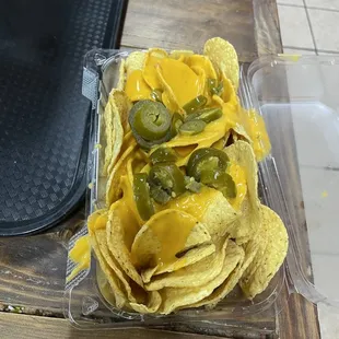 "LARGE NACHOS"  THE TORTILLA CHIPS WERE STALE &amp; THE AMOUNT OF CHEESE IS ABSURD!
