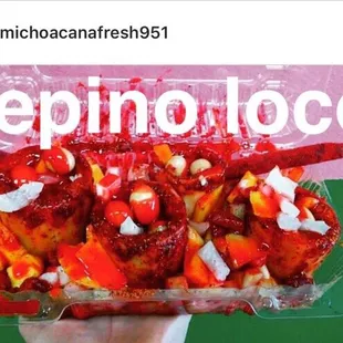 a person holding a container of food