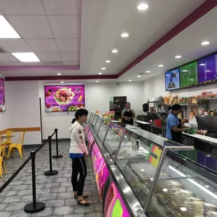 a woman standing in front of the counter