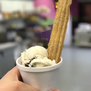 Churro with some Ice cream come an get one