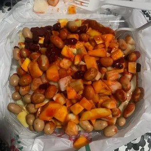 a bowl of beans, carrots, and other vegetables