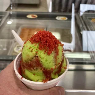 Limon con chamoy dusted in flaming hot Cheetos  yesss!