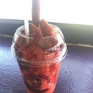 Watermelon scoops, strawberry slices, chamoy, Tajin, and tamarind candy!! Yummmmy custom cup!