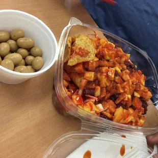 Tostilocos, they include cucumber, hicama, chaca chaca, mango, chamoy and Valentina