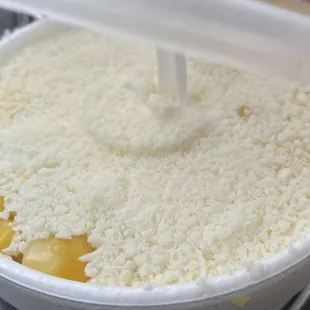 a bowl of rice with a spoon sticking out of it