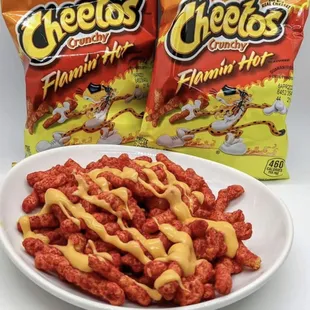 a plate of cheetoes and a bag of cheetoes