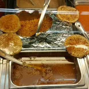 a variety of food items in a buffet