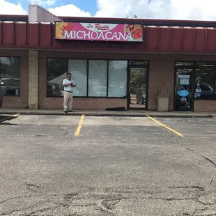 a man standing in a parking lot