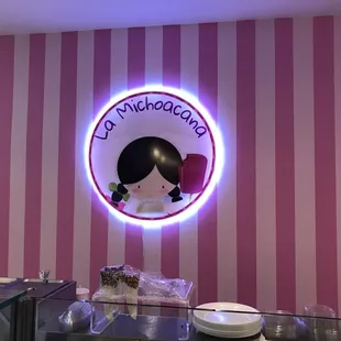 a pink and white striped wall