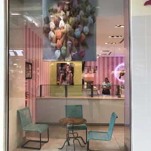 two chairs and a table in front of a window