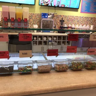 a counter with a variety of food items