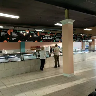 two people standing at a counter