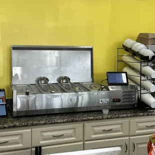 a counter with a variety of food items