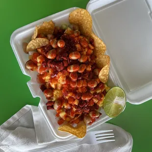  a container of chips and salsa