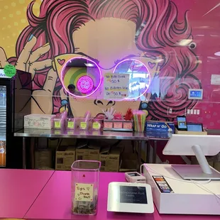 a woman with pink hair and glasses