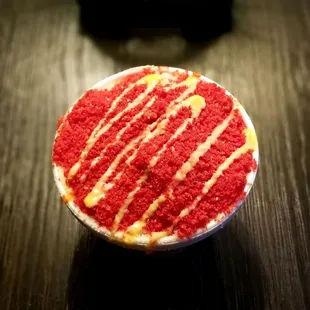 Elote with hot cheetos on top..