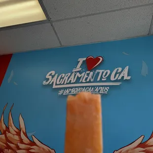 a hand holding a popsicle