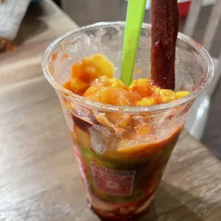 a glass of drink with a straw