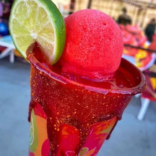 a margarita with a lime slice on top