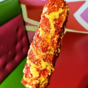 Elote Con Hot Cheetos with extra chili.