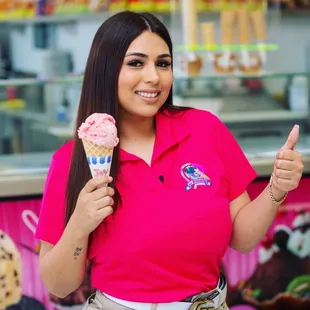 a woman holding an ice cream cone