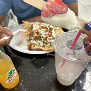 a person eating a popsicle