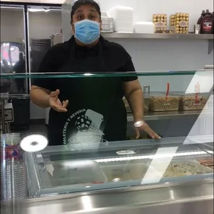 The Cashier that was not wearing a mask when we came in the store. She put it on when she realize I was filming her.