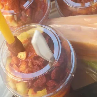 two cups of fruit and a stick