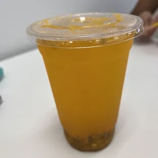 a plastic cup of juice