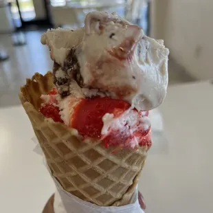 Double scoop ( Gansito and Fresca de crema) in a waffle cone