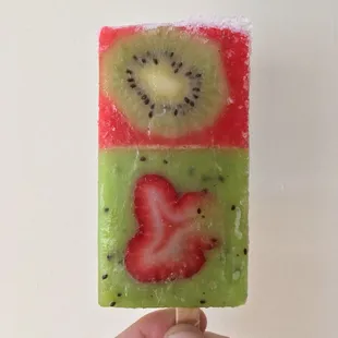 Lime and strawberry popsicle