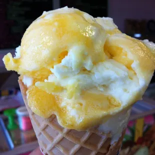 A scoop of piña colada ice cream in a sugar cone for just $2