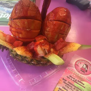 a pineapple filled with bacon and watermelon
