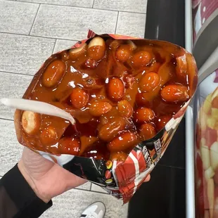 Terrible service I asked for extra sauce and they gave me this. Seriously a joke. Would not recommend this place for tostilocos.