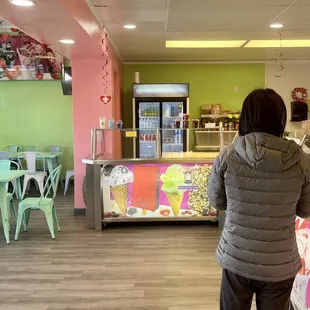 a woman standing in front of the counter