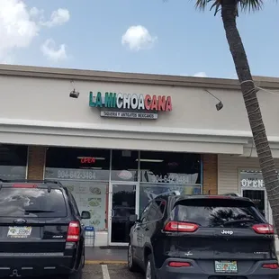 cars parked in front of the store