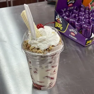 a cup of ice cream and fruit