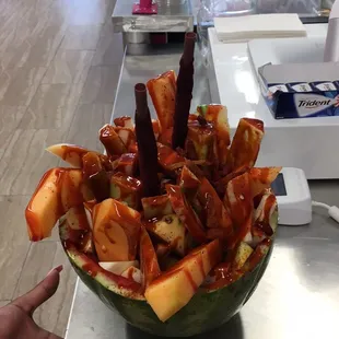 a watermelon filled with fruit