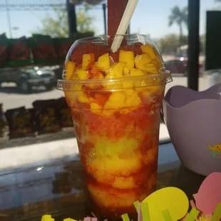 Mangonada medium size $4.50 during happy hour. Mango,limon,Sandia ice cream