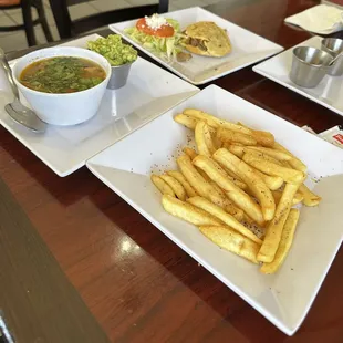 French fries, charro beans guacamole, &amp; a picadillo gordita