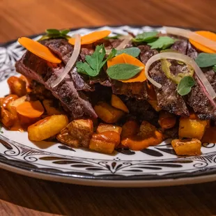 Carne Con Mole Amarillo - grilled steak, roasted potatoes, chorizo, yellow mole, escabeche, served with tortillas