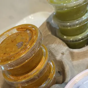 Both salsas are good, but the orange one is the best!