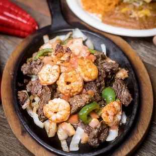 a skillet of mexican food