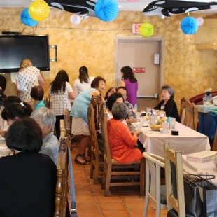Guests Enjoying the Decorated Party Room at La Mision