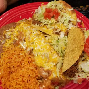 La Mission Combo Platter - crispy beef taco, beef tostada, rice, beans and beef enchilada with green chile sauce.