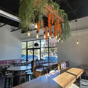 a dining area with tables and chairs
