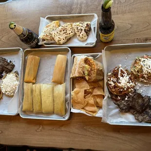 Tamales, burritos, quesadilla, and picadita with steak platters