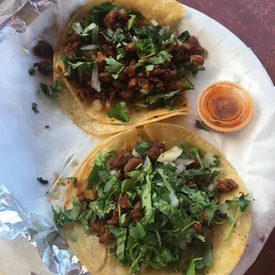 Tacos al pastor with cilantro , onions. Tasty tasty